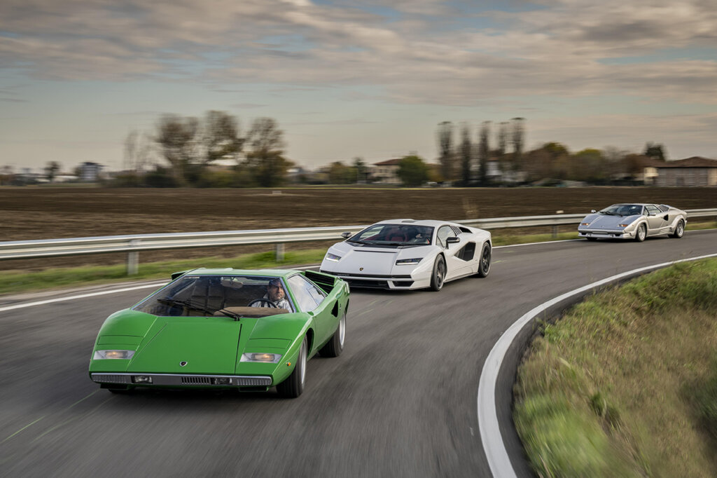 Grey, White, and Silver Lamborghini Countach cloudy sky behind it