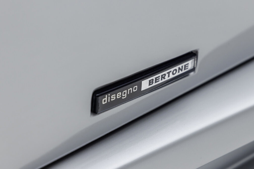 Countach Badge that says disegno bertone in black and white