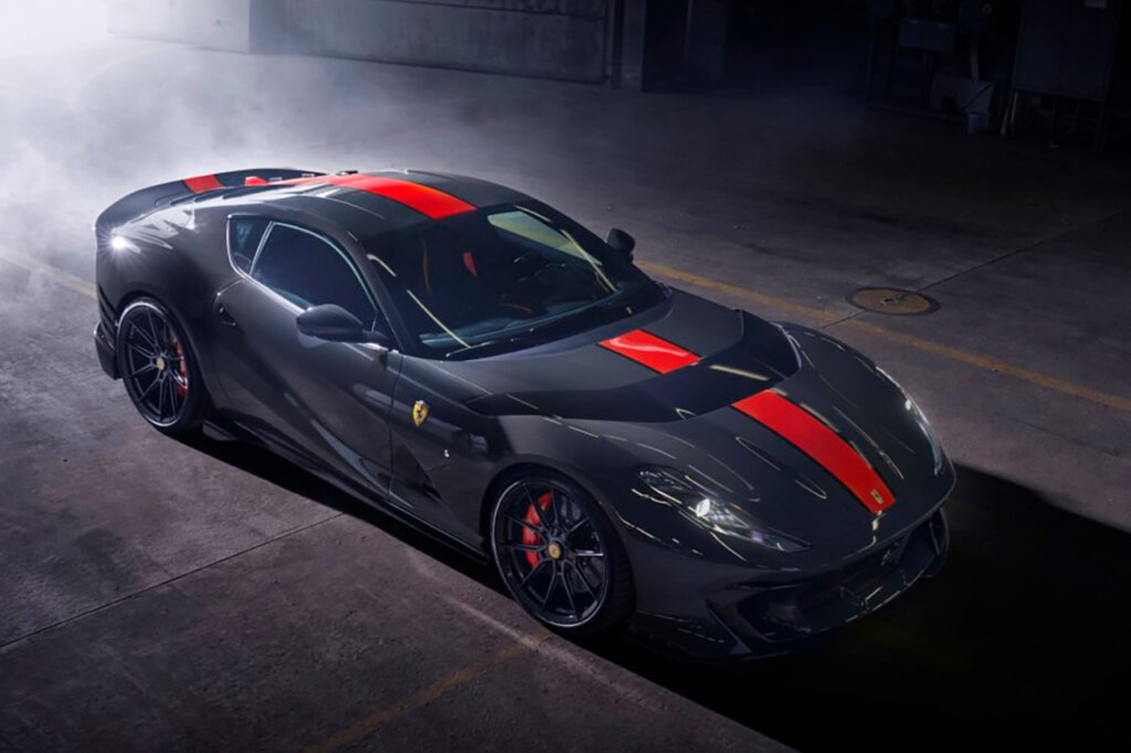 Blue grey car with red stripe in a smoky garage, dark background