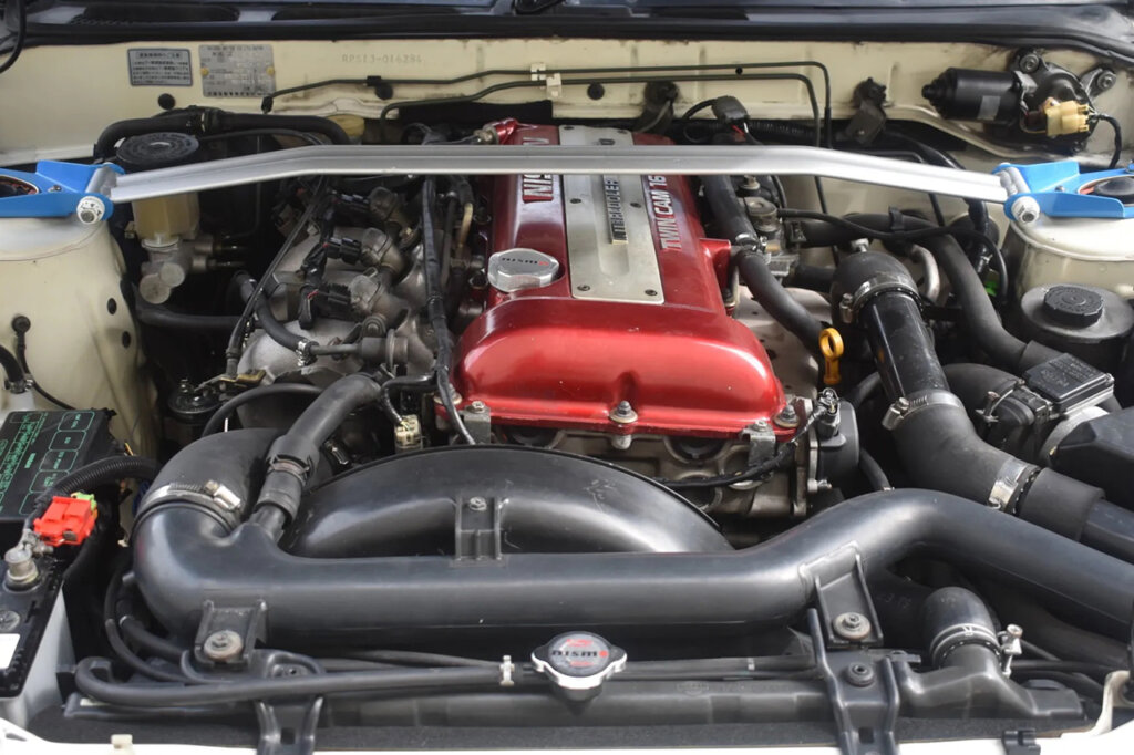 front view of the SR20DET surrounded by all the air ducts and tubings