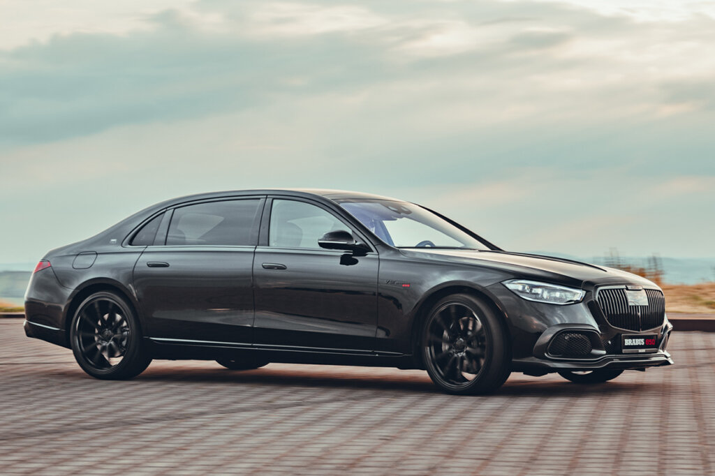 Brabus 850 dark grey turning on brick road clouds in background