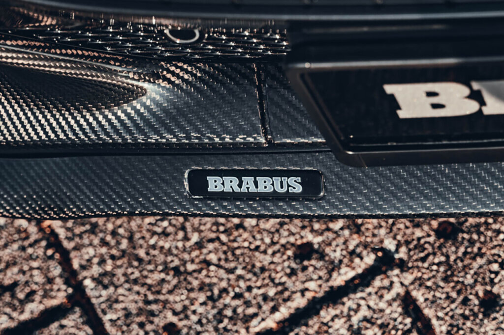 detailed carbon piece on brabus car brick ground below it