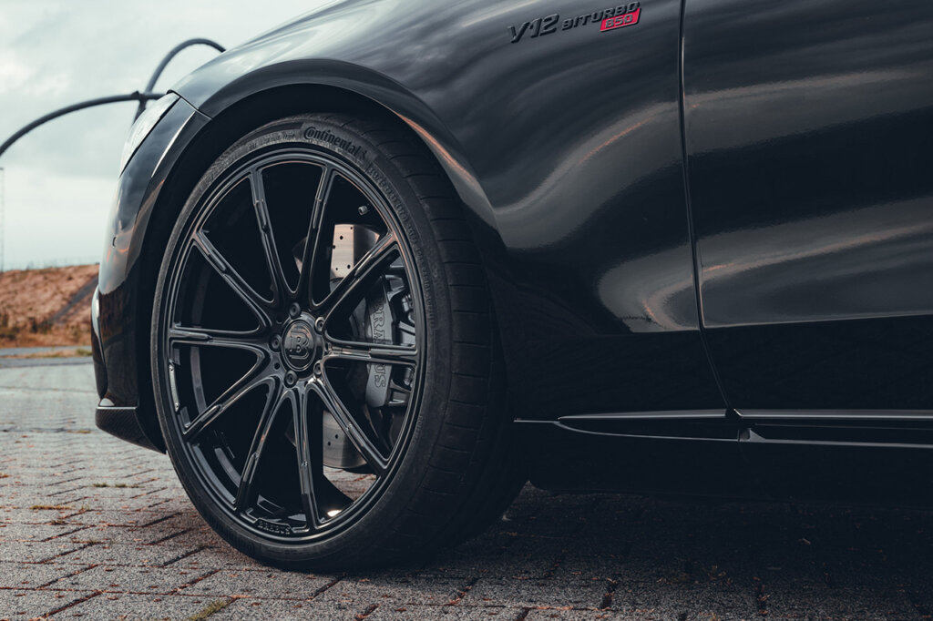 black wheel on black car on brick road