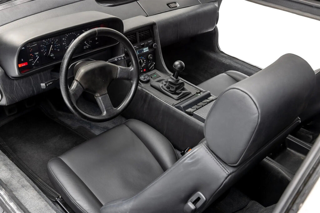 black interior with manual stick shift from a DMC