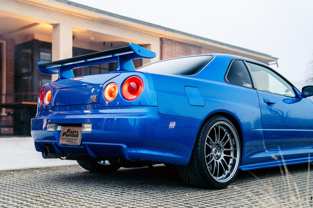 bayside blue r34 in front of a house