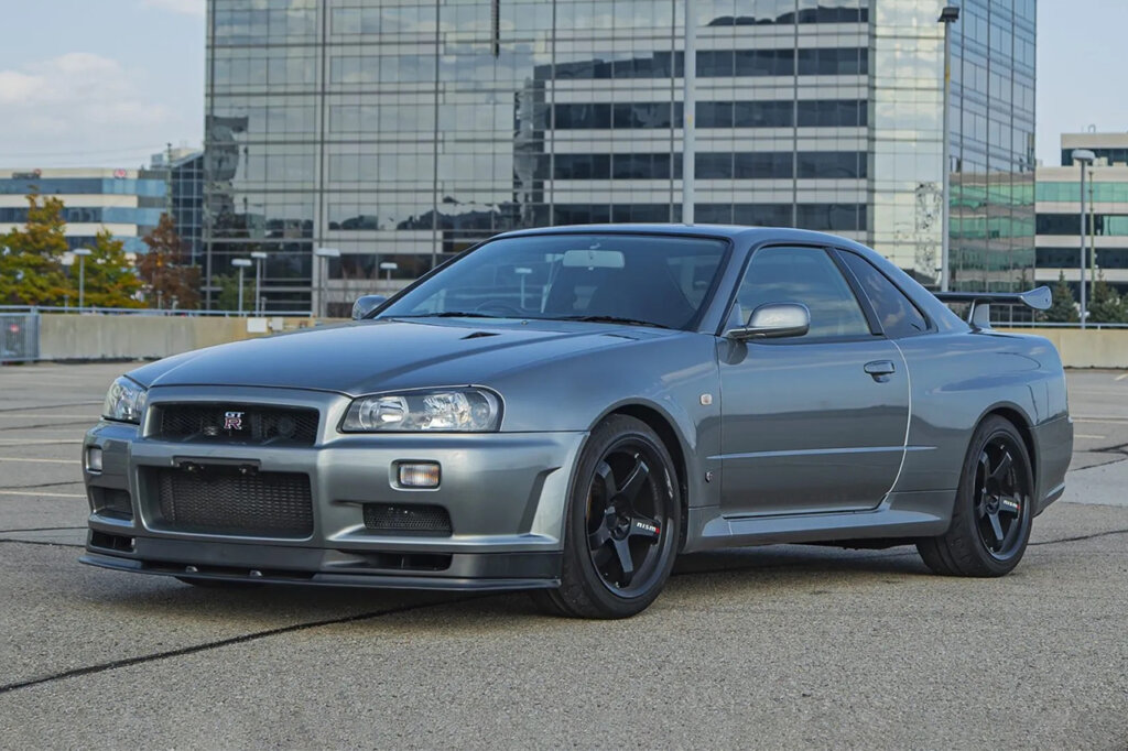 silver V-spec 2 with a building behind it