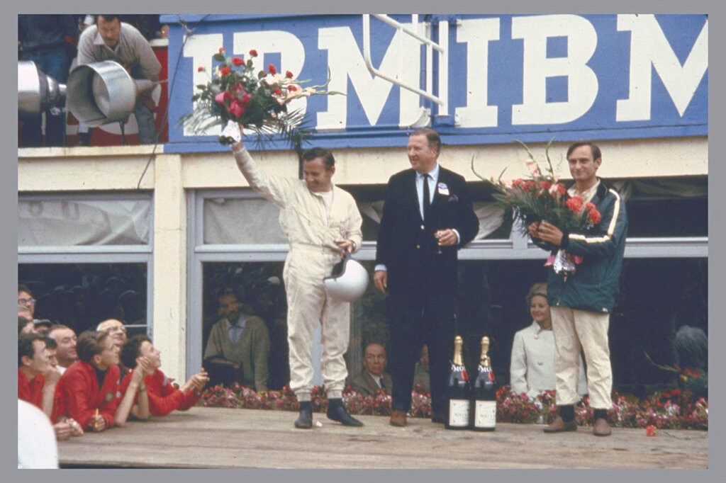 Bruce McLaren, Henry Ford II and Chris Amon on the victory podium
