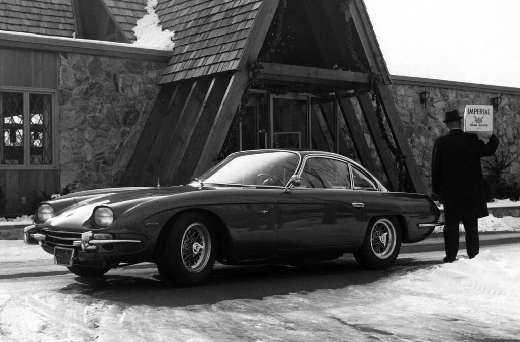 lambo 350 GT model in front of a lodge