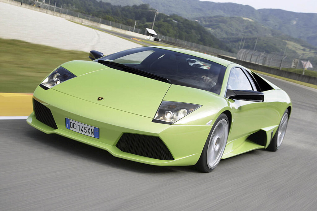 green lamborghini Murciélago speeding on asphalt