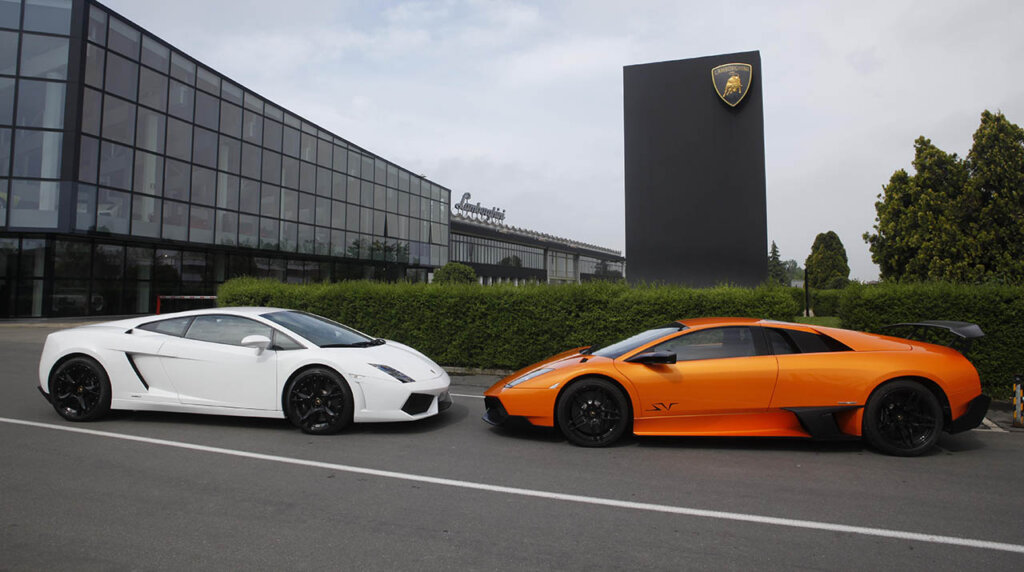 white Murciélago and orange gallardo