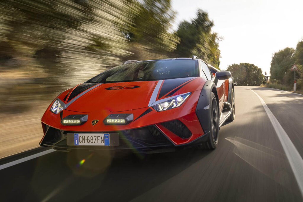 red Huracán sterrato on a country road