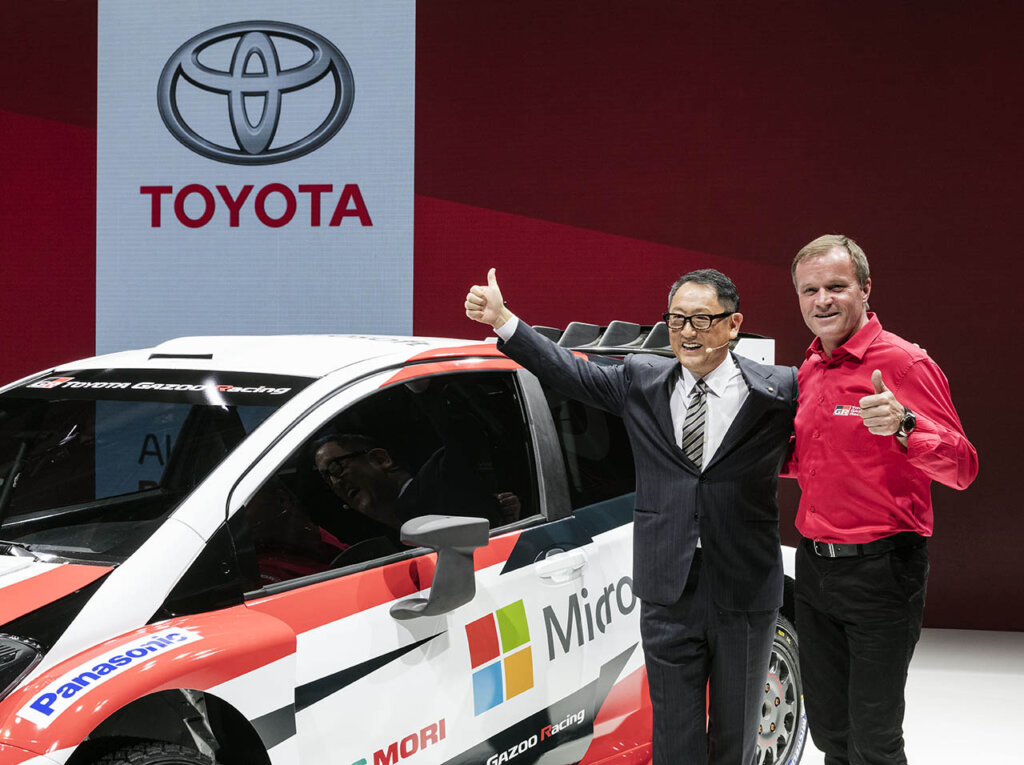 Tommi Mäkinen next to Toyota Yaris World Rally Car