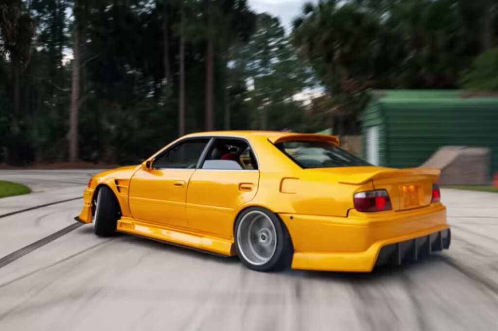 Yellow Toyota Chaser X100 Tourer V drift through a turn