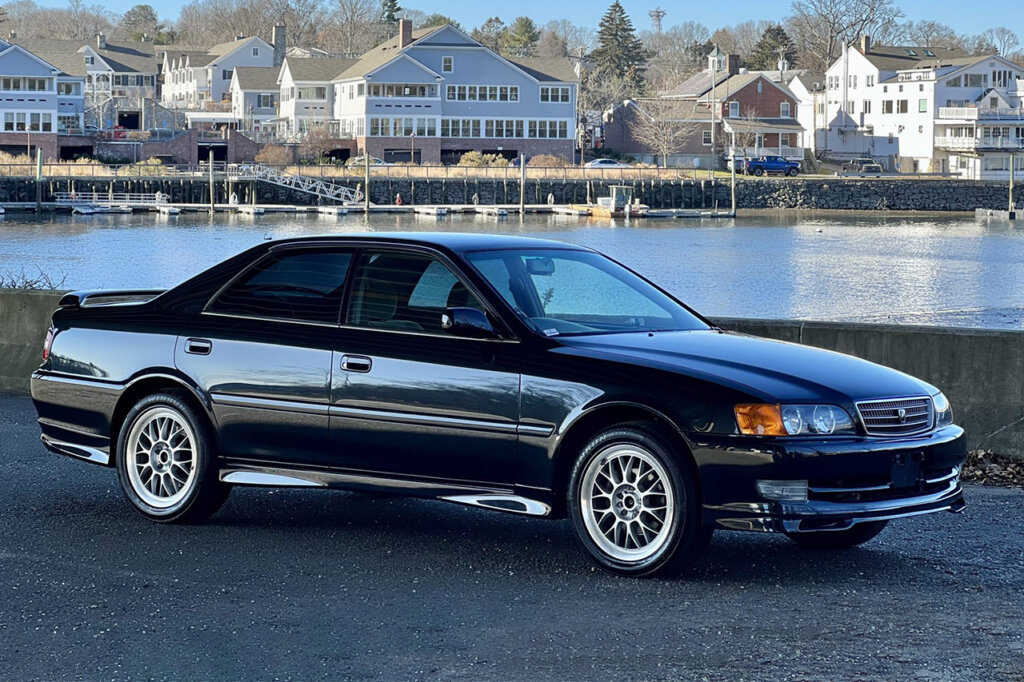 Toyota Chaser Avante Four G parked next to a river
