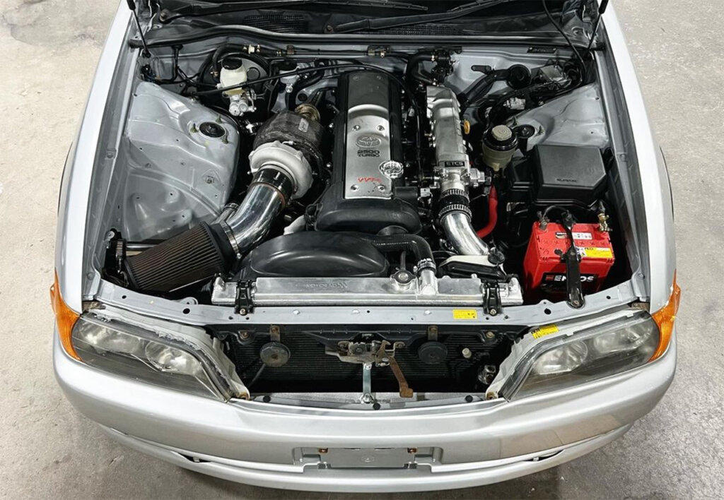 Toyota Chaser with a 1JZ-GTE Engine hood is propped open