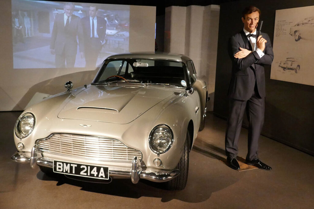 sean connery next to an aston martin db5