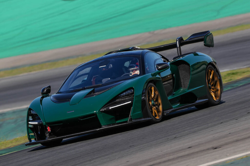 dark green mclaren senna on a racetrack