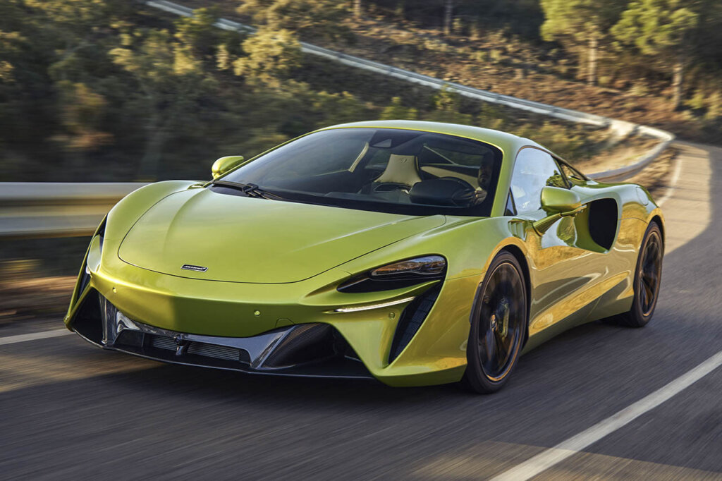 green artura driving near a cliff