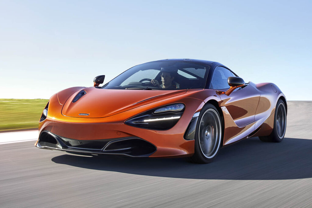 red orange mclaren 720s on a racetrack