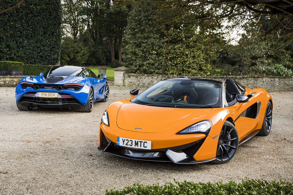 blue and orange mclaren cars on stone road