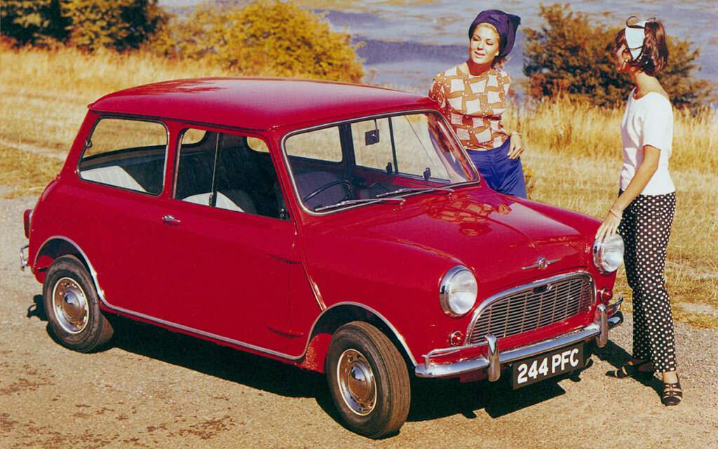 red mini next to a lake