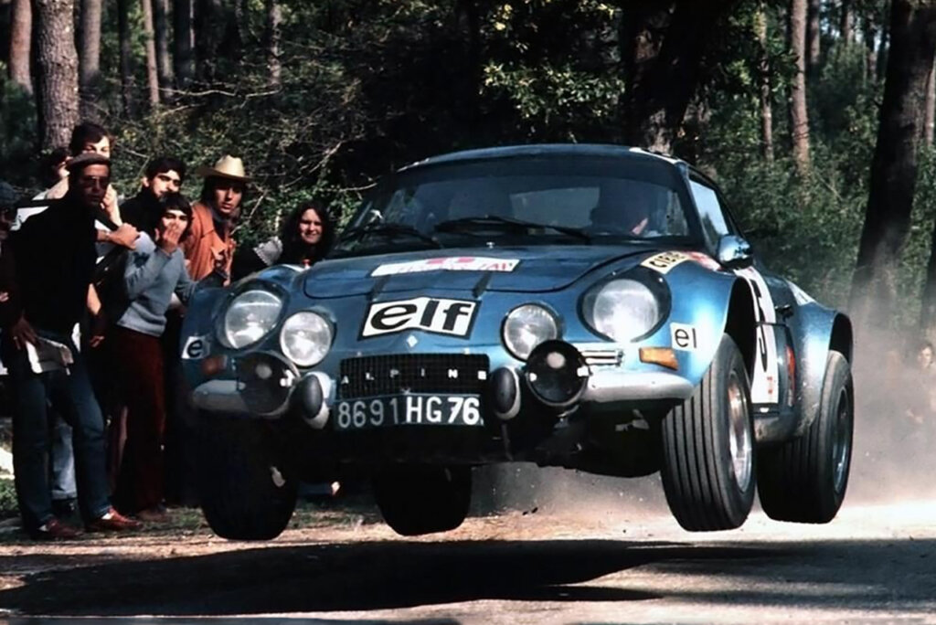 Blue ELF Alpine rally race car airborne and driven by Jean-Luc Thérier