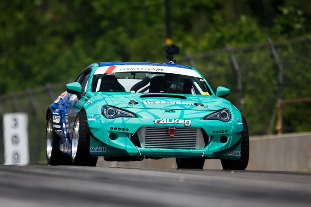 Teal Subaru BRZ on racetrack for Formula Drift 2014