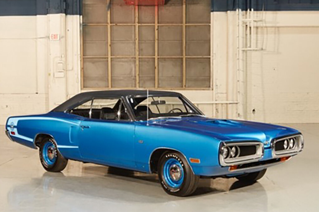 Blue Dodge Super Bee Charger parked in a warehouse