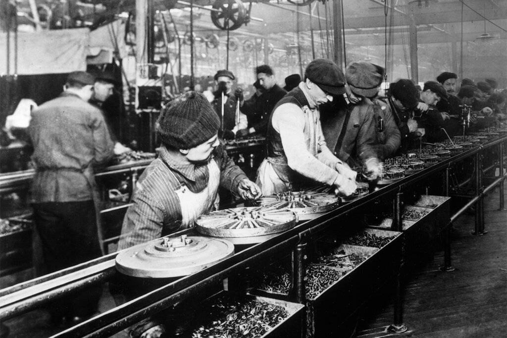 Black and white photo of employees working in the Ford Motor company warehouse