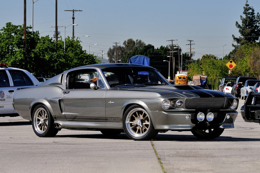 Silver Ford GT500 Mustang from Gone in 60 Seconds (2002) next to other cars on a street