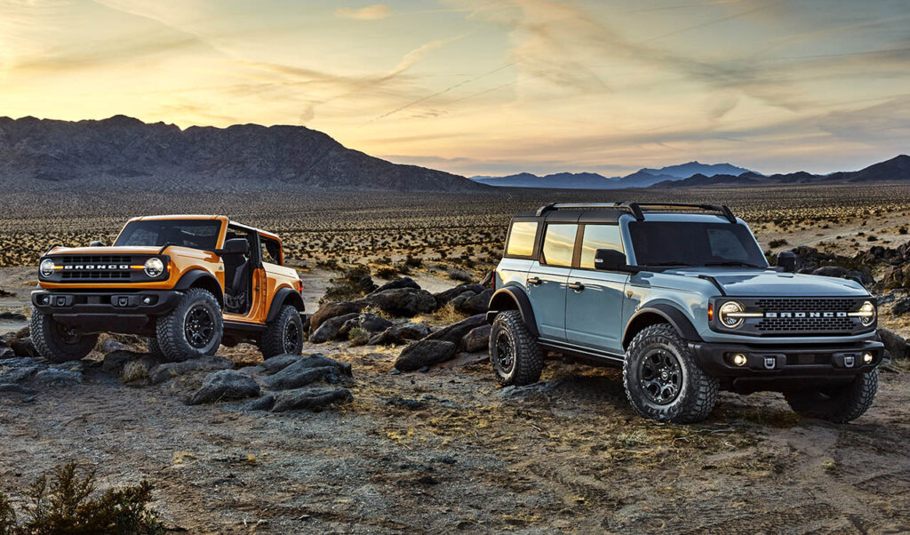 cyber orange and cactus sixth gen bronco in a desert
