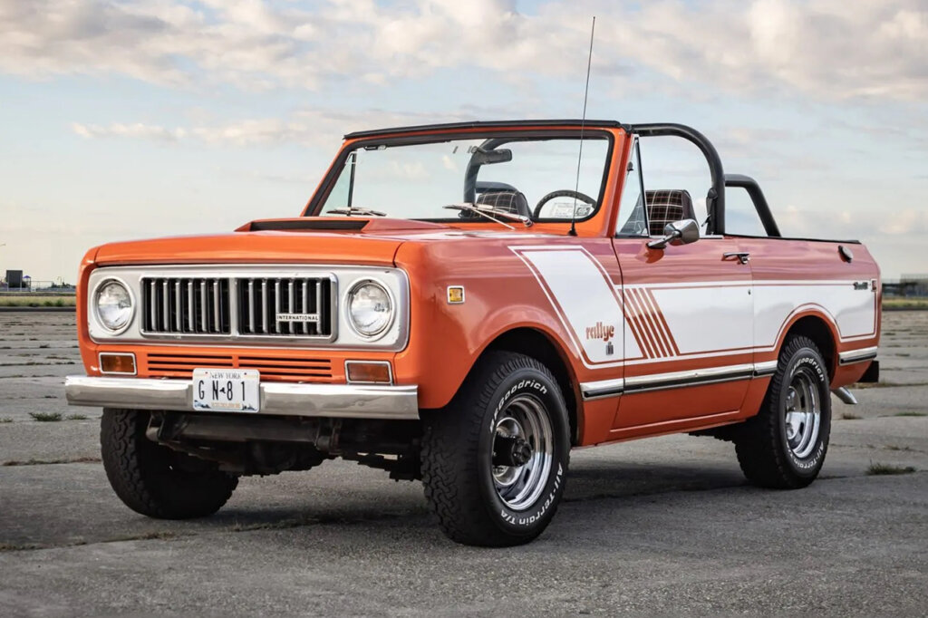 Orange and white Scout II with clouds in the sky