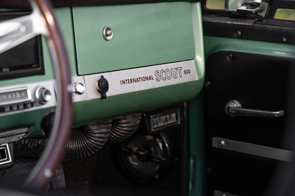 Scout 800 interior badging on a green passenger glove compartment