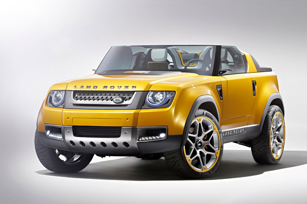 Yellow Land Rover DC100 Concept vehicle from 2015 on a white background