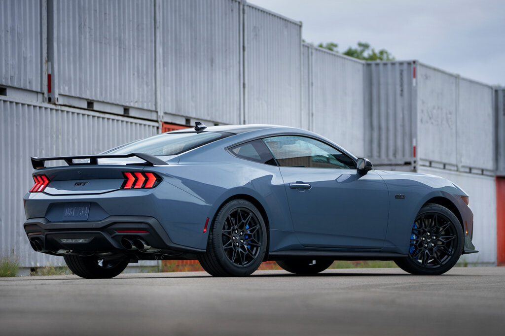 Rear shot of Ford Mustang GT parked at an angle with containers behind it
