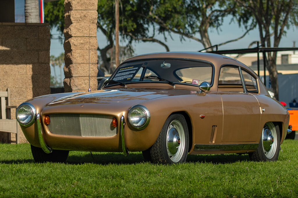 Brown Porsche 356 1600 Super parked on the grass
