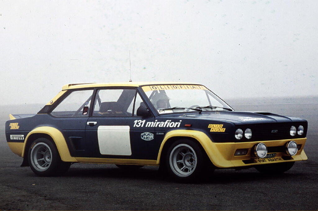 black and yellow Fiat 131 Abarth rally car with white background