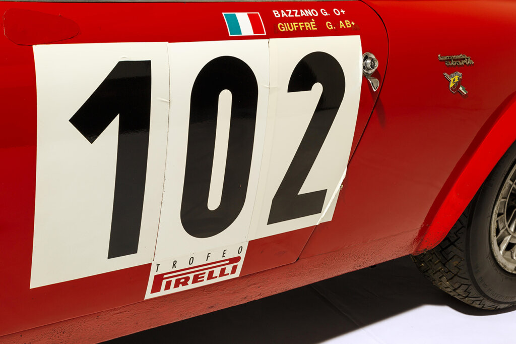 Abarth Simca 1300 red race car with the number 102