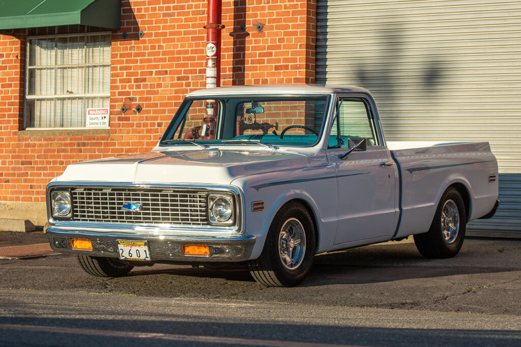 White Chevy C10 with blue pin stripe on the fenders of the truck