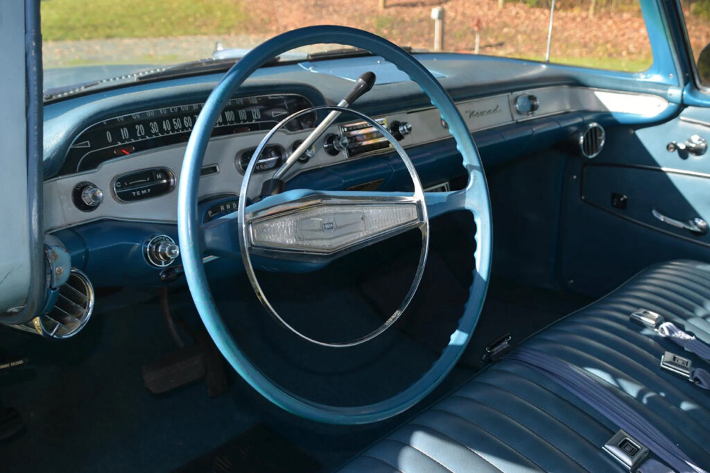 Blue interior with white dash panel accents of a 58' Chevy nomad