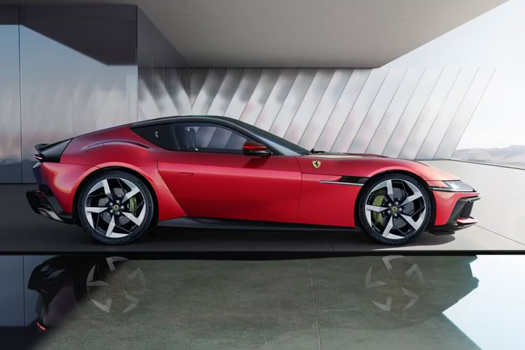 Red Ferrari 12Cilindri parked in front of a house