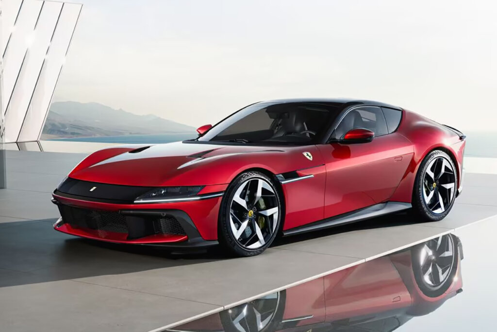 Red Ferrari parked with clear skies in the background