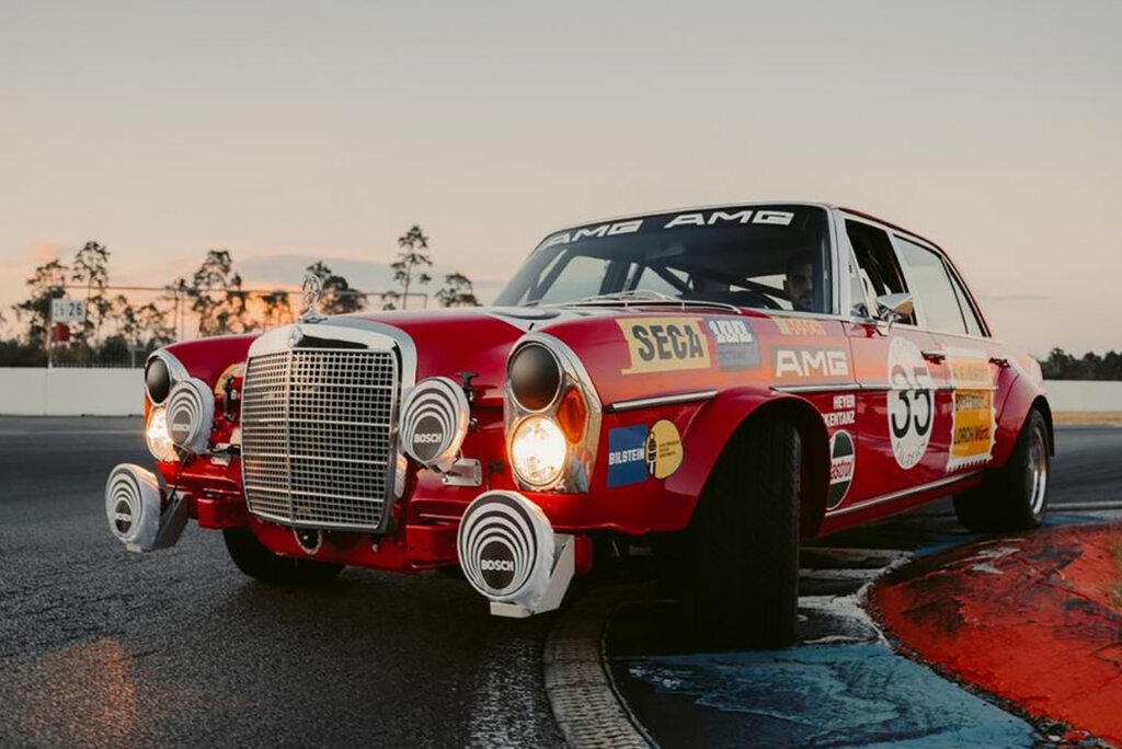 Close up detail shot of a red Mercedes on a racetrack