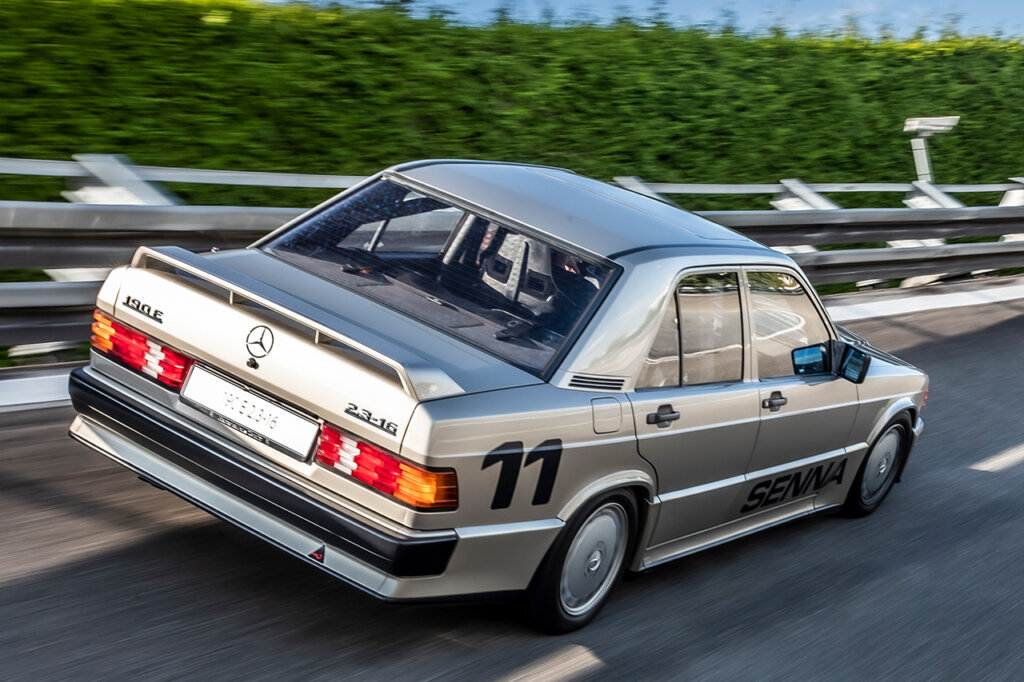 Silver race car Mercedes 190 E vehicle on race track