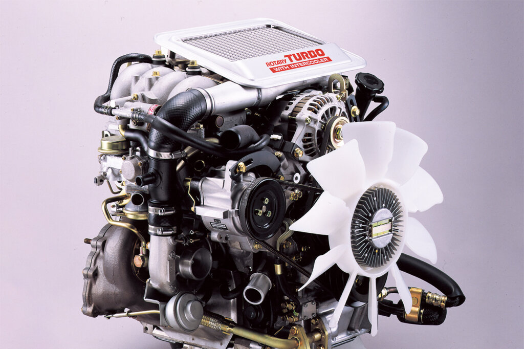 Detailed shot of rotary engine on grey background