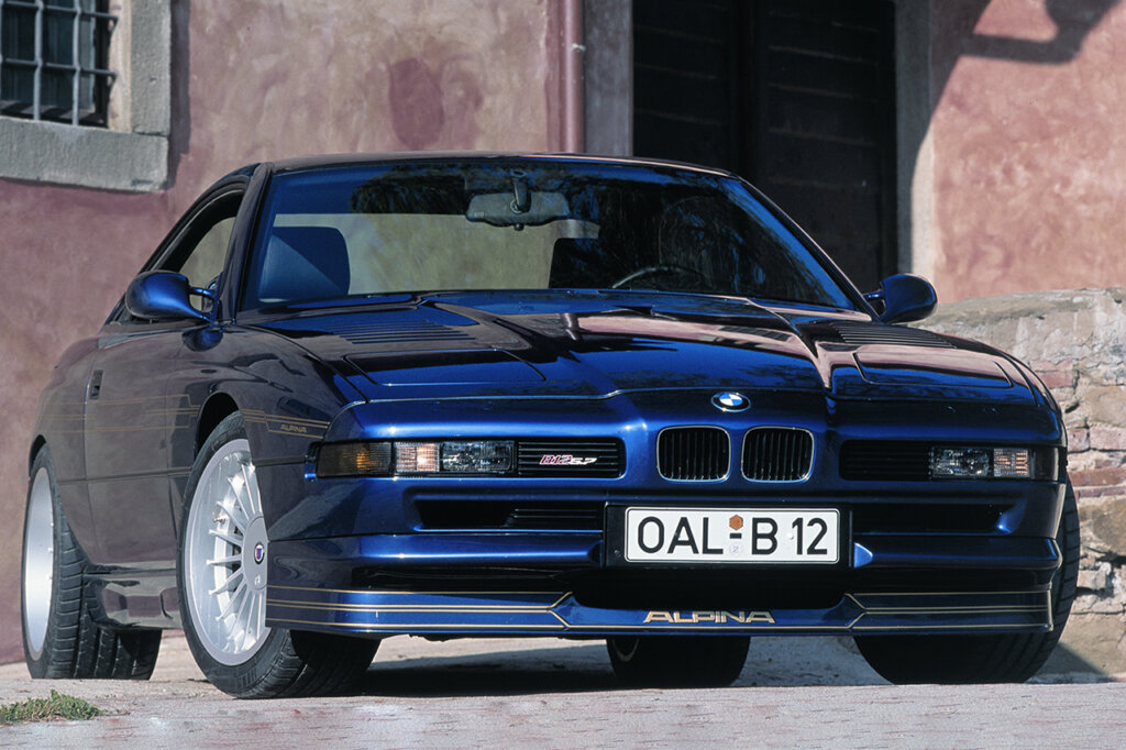Blue E31 7-Series BMW Alpina parked in front of a house