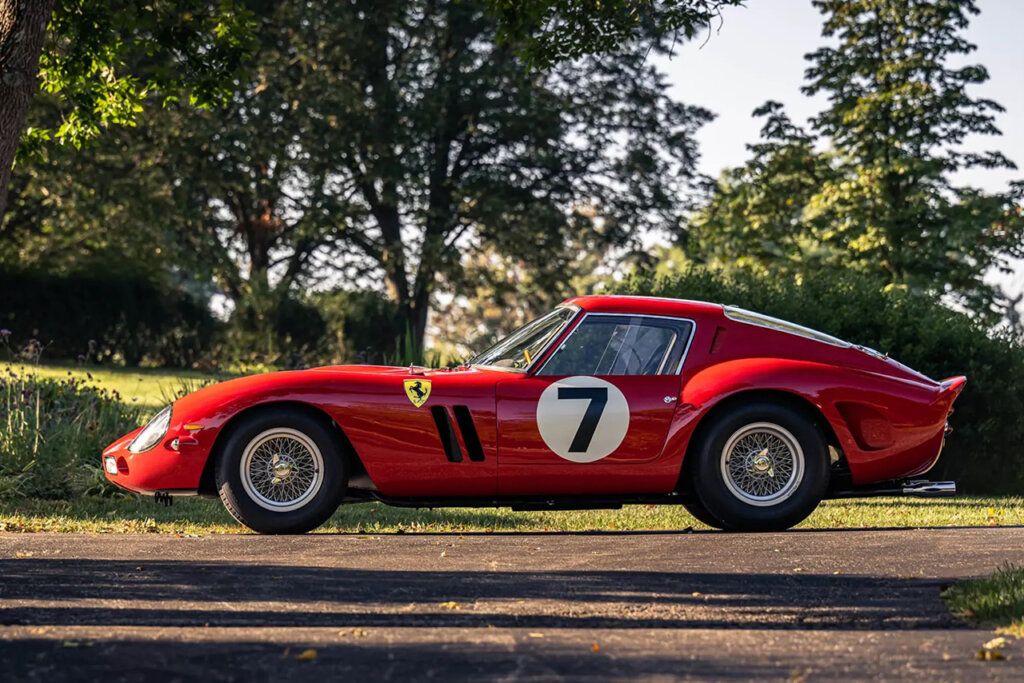 Red Ferrari 250 GTO with number 7 in a white circle on the door