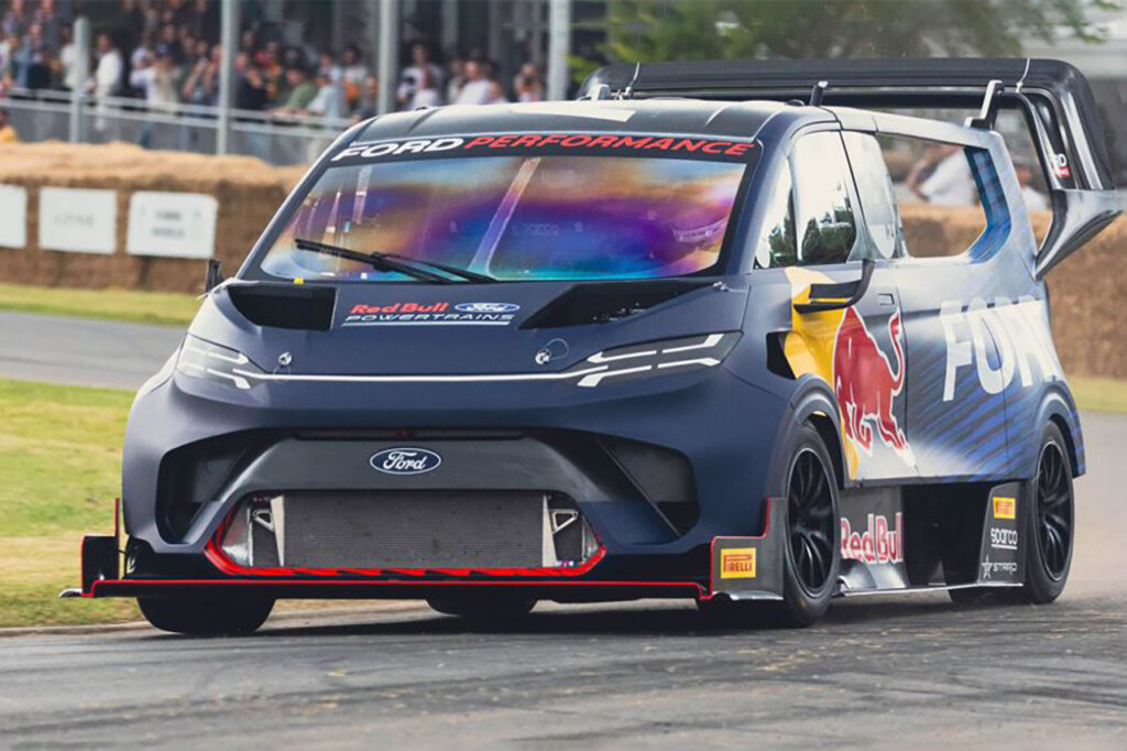 Ford Transit Red Bull supervan driving on the Goodwood festival of speed racetrack