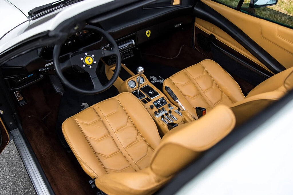 Beige leather interior and gated manual shifter with Ferrari steering wheel
