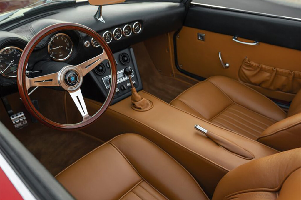 Brown leather with modified steering wheel of a car with a black dash